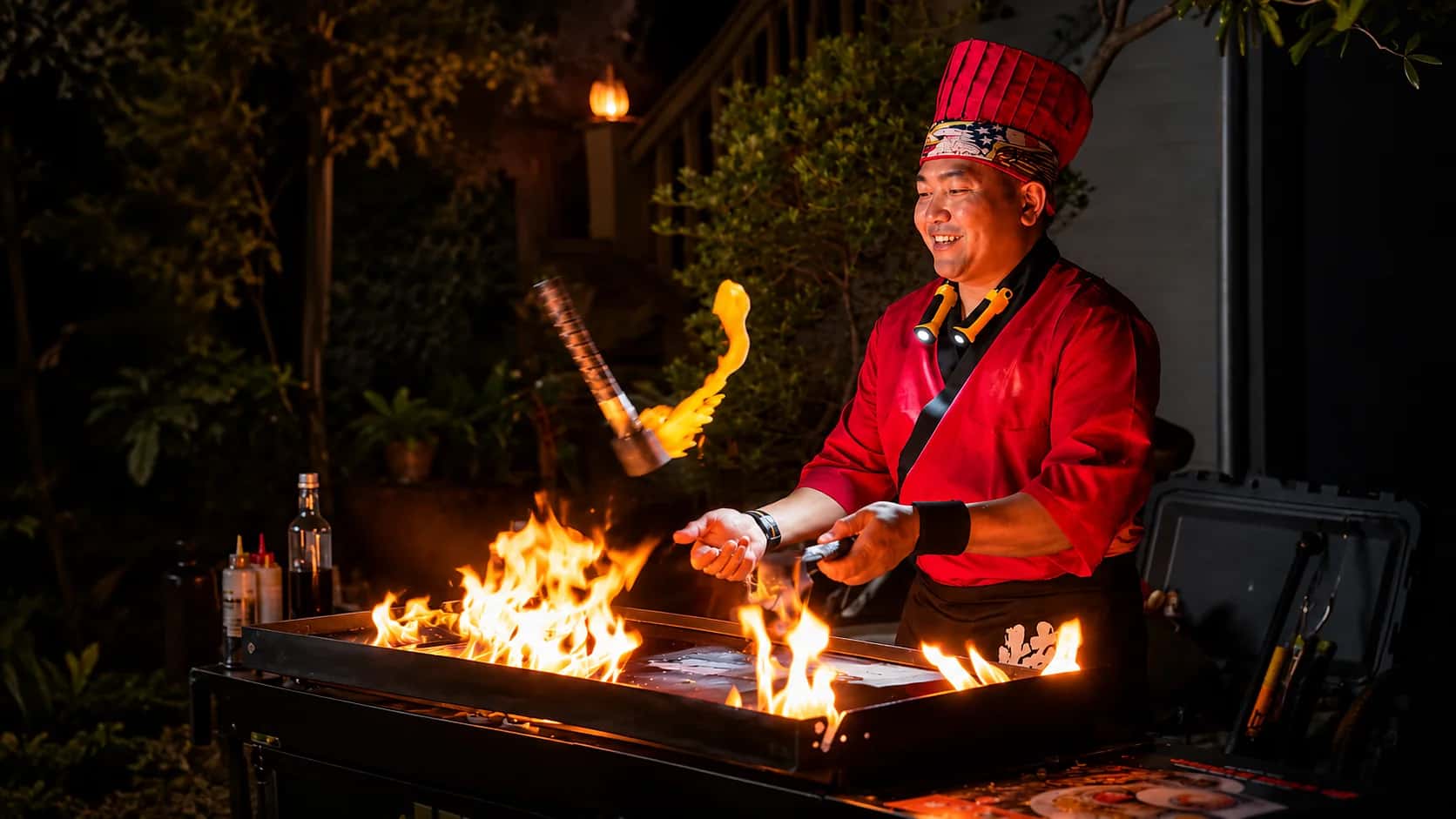 Hibachi Five Star chef performing a live fire show for a private party